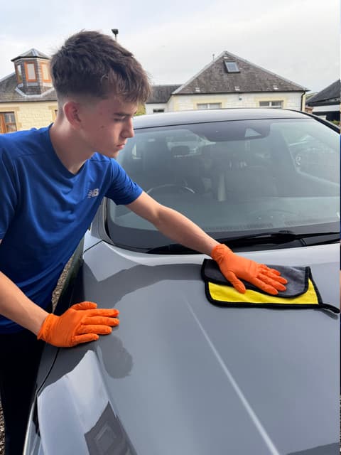 Noah valeting a car